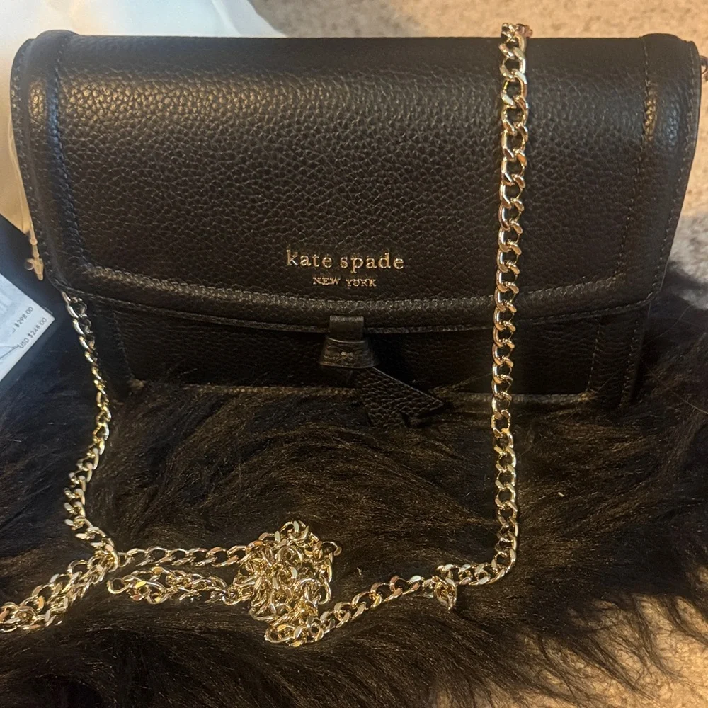 kate spade New York Knott Flap black pebbled leather crossbody with gold chain